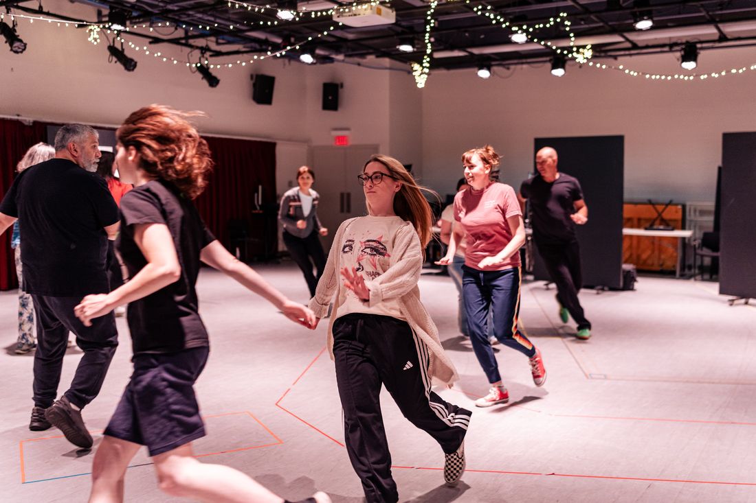 A participant moving through an improvisation exercise
